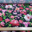 Crepe Flowers Black Background fabric - Koshibo-type crepe fabric with flower drawings on a black background. The fabric is 150cm wide and its composition is 100% polyester.