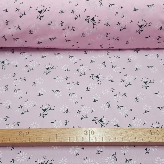 Fine Cotton Flowers Pink fabric - Fine cotton bed sheet-like fabric with dandelion-like flower patterns on a light pink background. The fabric is 150cm wide and its composition is 100% cotton.