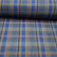 Wool Check Liverpool Blue Brown fabric - Wool fabric with Scottish plaid or tartan pattern Liverpool style in blue and brown tones with dark stripes. Wool fabric made in Spain. The fabric measures 140cm wide and its composition 65% polyester - 35% wool