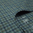 Virgin Wool Checkered Gray Blue fabric - Pure virgin wool fabric with blue and gray checkered patterns. This is a “Gran Reserva fabric” of Textiles Siles, with great quality. The fabric is 140cm wide and its composition is 100% wool.