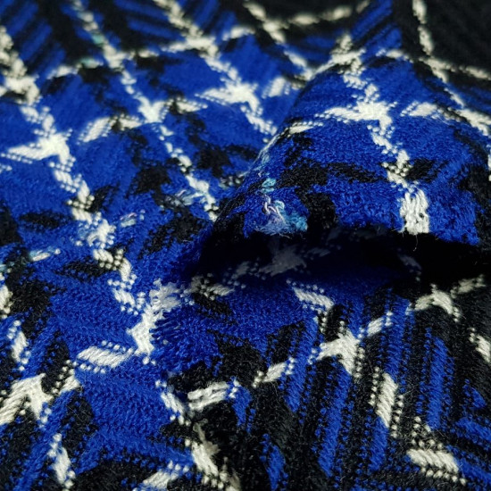 Wool Plaid Tartan Blue Black White fabric - Wool fabric mixed with polyester with blue, black and white tartan pattern. You can see spike shape in black strokes. The fabric is 150cm wide and its wool and polyester composition.