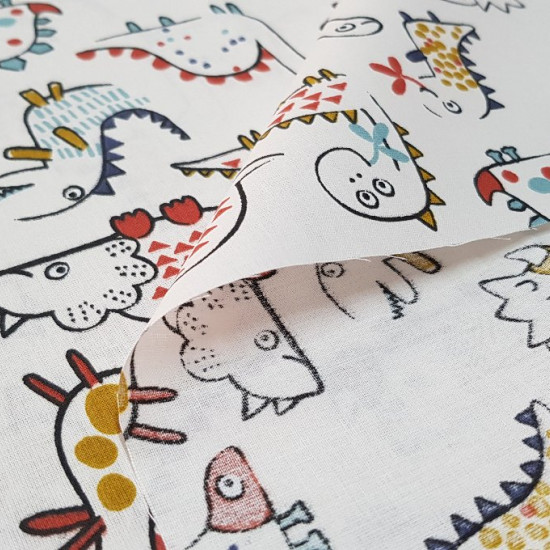 Cotton Funny Dinosaurs - Very funny cotton fabric with drawings of different dinosaurs with strokes of various colors on a light background.