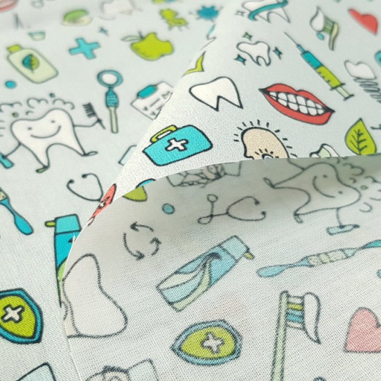Cotton Dentist fabric - Very funny cotton fabric with drawings of teeth, brushes, mouths, molars ... themed dentist on a gray background. Ideal for gowns, hats, bags and other accessories ...  