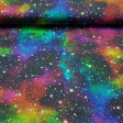 Digital Cotton Speckled Galaxy fabric - Cotton fabric in digital print with multicolored galactic themed drawings on a black background. The fabric is 150cm wide and its composition 100% cotton.
