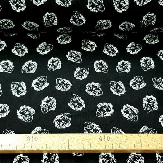 Cotton Einstein Faces fabric - Cotton fabric with drawings of Einstein faces on a black background. The fabric is 150cm wide and its composition is 100% cotton.