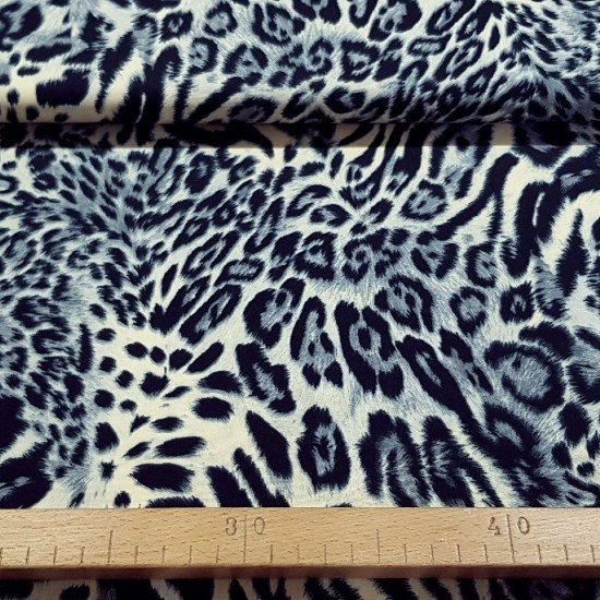 Cotton Animal Print Cream fabric - Cotton fabric with animal print in cream and gray tones. The fabric is 140cm wide and its composition is 100% cotton.
