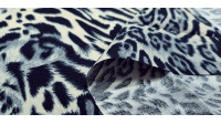 Tela Algodón Animal Print Crema - Tela de algodón con estampado animal print en tonos crema y gris. La tela mide 140cm de ancho y su composición 100% algodón.