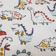 Cotton Funny Dinosaurs - Very funny cotton fabric with drawings of different dinosaurs with strokes of various colors on a light background.