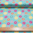 Cotton Tea Party Pin Wheels fabric - Cotton fabric with drawings of swirls or colored umbrellas on a light blue background. The fabric is 110cm wide and its composition is 100% cotton.