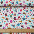 Cotton Owls Colors White fabric - Cotton fabric with drawings of owls in many colors on a cream white background with flowers. This fabric is part of The Craft Cotton Company's Happy Owls collection. The fabric is 110cm wide and its compositi