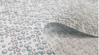 Tela Algodón Burbujas del Mar - Tela de algodón ancho americano con dibujos de burbujas sobre un fondo blanco. La tela mide 110cm de ancho y su composición 100% algodón.