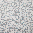 Tela Algodón Burbujas del Mar - Tela de algodón ancho americano con dibujos de burbujas sobre un fondo blanco. La tela mide 110cm de ancho y su composición 100% algodón.
