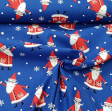 Cotton Christmas Noel Blue fabric - Christmas cotton fabric with Santa Claus drawings on a blue background with snowflakes. The fabric is 110cm wide and its composition is 100% cotton.