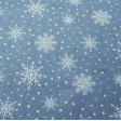 Cotton Christmas Forest Snowflakes fabric - Christmas cotton fabric with drawings of snowflakes on a background with white polka dots simulating snow. The fabric is 110cm wide and its composition is 100% cotton.