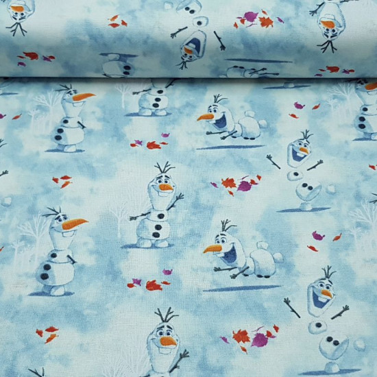 Cotton Disney Frozen 2 Olaf fabric - Disney digital cotton fabric with the character Olaf snowman on a blue background, leaves and snowy white trees. The fabric is 110cm wide and its composition 100% cotton.
