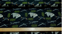 Cotton Star Wars Ships Millennium Falcon fabric - Cotton poplin fabric licensed from Disney Star Wars with drawings of several spaceships, rebel ships and the great Millennium Falcon on a black background of stars where Star Wars logos also appear in yell