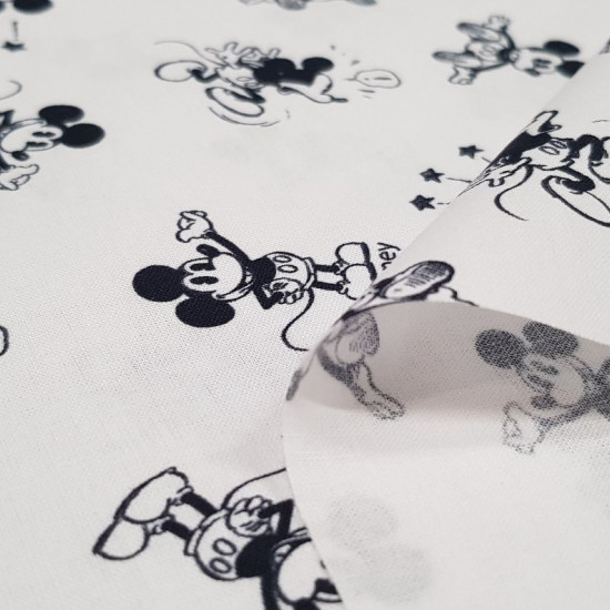 Tela Algodón Disney Mickey Diminuto Clásico - Tela de algodón licencia Disney con dibujos del personaje Mickey Mouse en su versión clásica de tamaño pequeño sobre un fondo blanco. La tela mide 150cm de ancho y su composición 100% algodón.