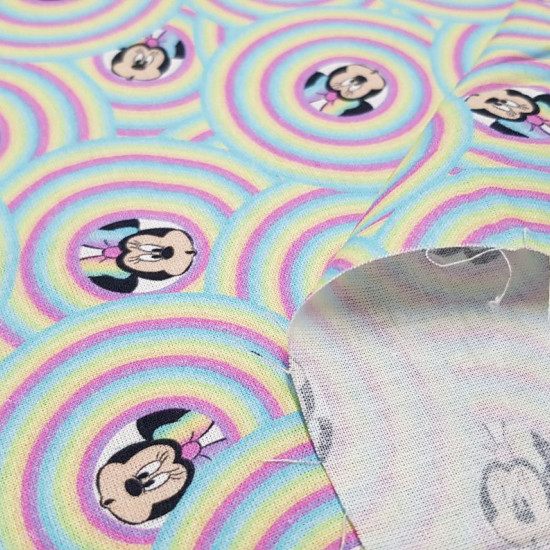 Cotton Disney Minnie Rainbow Bubbles fabric - Disney licensed cotton fabric with drawings of the Minnie character on rainbows forming bubbles. The fabric is 150cm wide and its composition is 100% cotton.