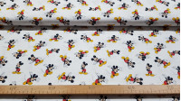 Tela Algodón Disney Mickey Mouse - Tela de algodón licencia Disney con dibujos del personaje Mickey sobre un fondo blanco. La tela mide entre 140-150cm de ancho y su composición 100% algodón.