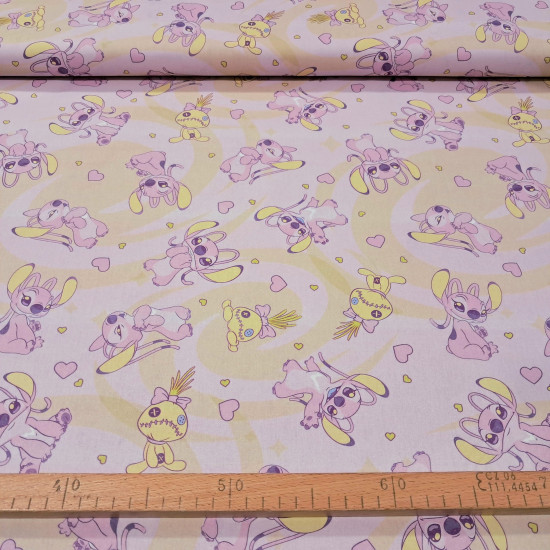 Cotton Disney Stitch Angel Hearts fabric Pastel pink cotton poplin fabric with spiral background and Angel (Stitch's girlfriend) print with hearts and rag dolls