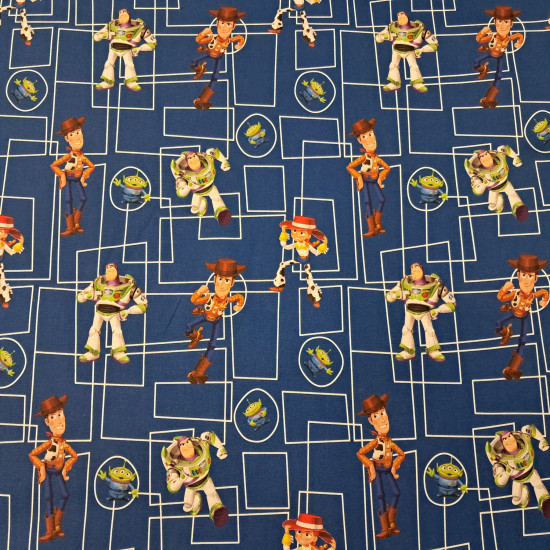 Tela de popelín de algodón azul rey con dibujo técnico de rectángulos y los personajes Woody, Buzz Lightyear, Jessie y los Aliens de Toy Story