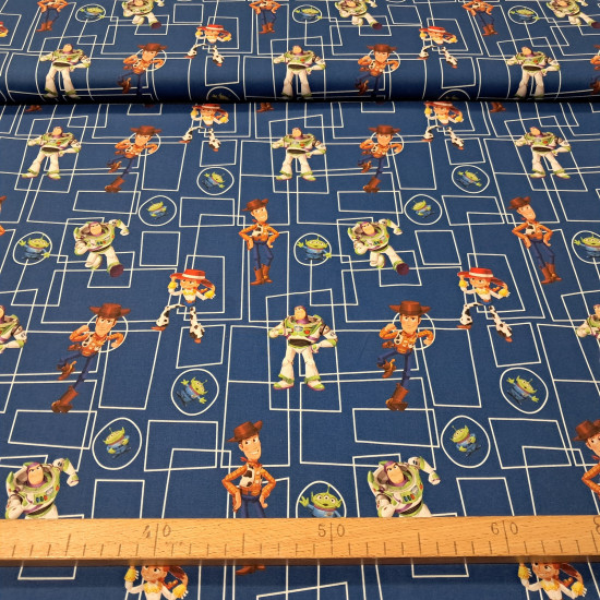 Tela de popelín de algodón azul rey con dibujo técnico de rectángulos y los personajes Woody, Buzz Lightyear, Jessie y los Aliens de Toy Story