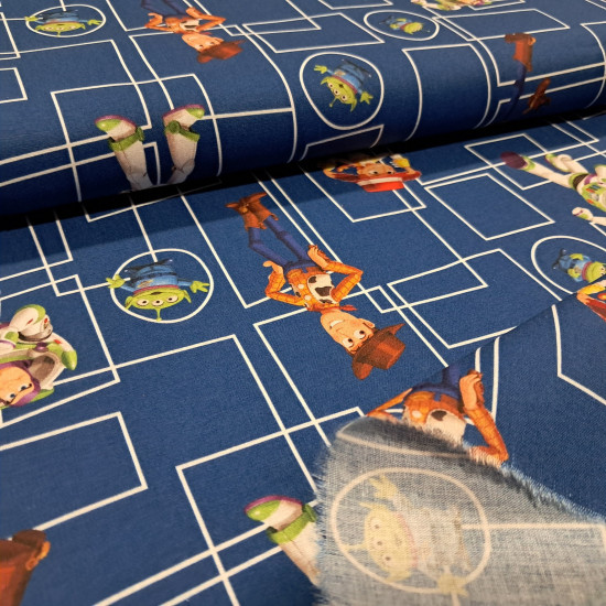 Tela de popelín de algodón azul rey con dibujo técnico de rectángulos y los personajes Woody, Buzz Lightyear, Jessie y los Aliens de Toy Story