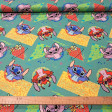Teal cotton poplin fabric with a Stitch and Angel print on yellow and green geometric shapes in a 90s style
