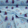Cotton Disney Frozen 2 Blue fabric - Disney licensed cotton poplin fabric with drawings of the characters Elsa, Anna and Olaff from the movie Frozen 2 on a blue background with the snowy forest. The fabric is 140cm wide and its composition is 100% cotto