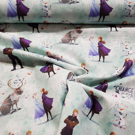 Cotton Disney Frozen 2 Change fabric - Disney licensed cotton fabric with drawings of the characters Anna, Elsa, Kristoff, Sven and Olaf on a background of snowy trees and phrases “Change is in the air” The fabric measures between 140-150cm wide and its c