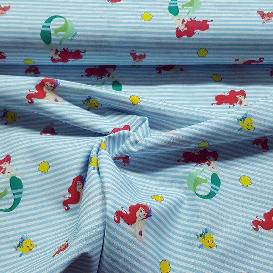 Cotton Disney the Little Mermaid Stripes fabric - Disney licensed cotton fabric with drawings of Ariel, the little mermaid, along with the characters Sebastian the crab and Flounder the fish, on a background of blue stripes. The fabric is 150cm wide and i
