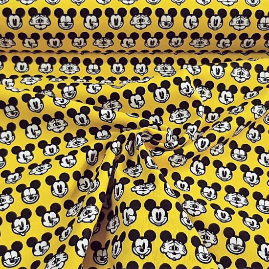 Cotton Disney Mickey Faces Yellow fabric - Disney licensed cotton fabric with drawings of Mickey faces making faces on a yellow background. The fabric is 110cm wide and its composition is 100% cotton.