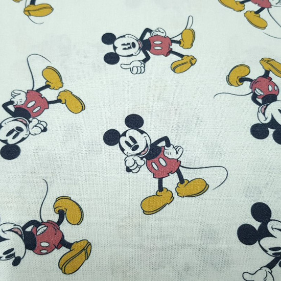Cotton Classic Disney Mickey Poses fabric - Disney cotton poplin fabric with drawings of the character Mickey in various poses on a white background. The fabric is 150cm wide and its composition 100% cotton.