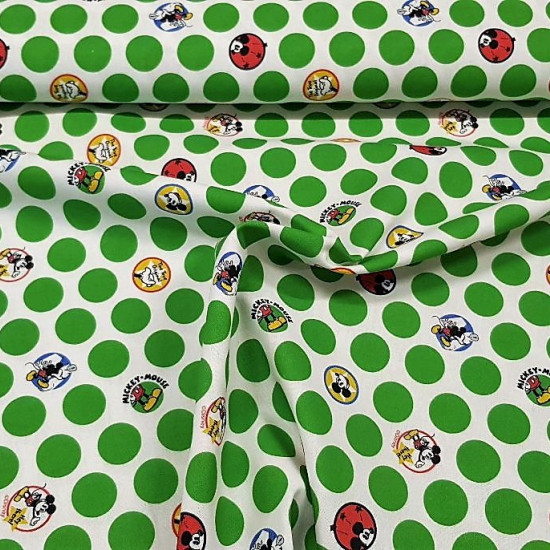 Cotton MIckey Green Polka Dots fabric - Licensed cotton fabric with Mickey Mouse drawings inside circles or dots with a white background and green dots around. The fabric is 150cm wide and its composition is 100% cotton.