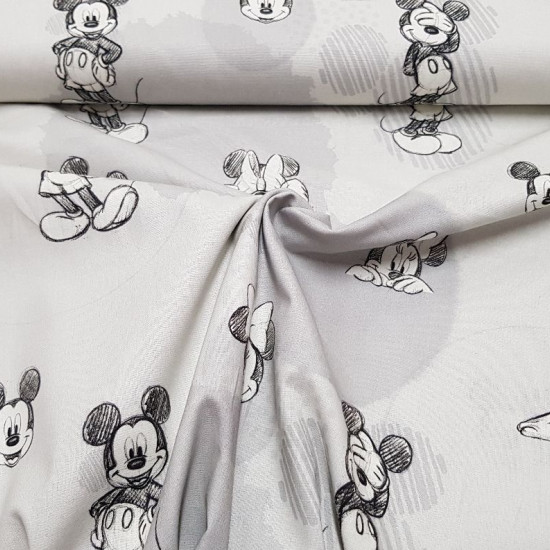 Tela Algodón Disney Mickey Minnie Bocetos - Tela de algodón licencia Disney con dibujos de bocetos/sketches de los personajes Mickey y Minnie sobre un fondo de colores grises con formas circulares. La tela mide 140cm de ancho y su composición 100% algodón