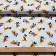 Cotton Disney Mickey Mouse fabric - Disney licensed cotton fabric with drawings of the Mickey character on a white background. The fabric measures between 140-150cm wide and its composition is 100% cotton.