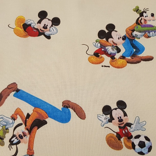 Cotton Disney Mickey and Friends fabric - Children's cotton fabric with Disney characters Mickey, Minnie, Goofy and Donald on a light yellow background.
