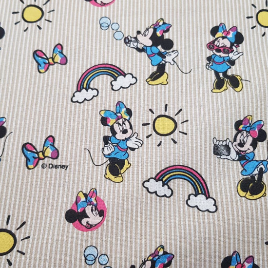 Cotton Disney Minnie Rainbow fabric - Disney children's cotton fabric with drawings of the character Minnie, rainbows, suns and bows, on a background of beige stripes. The fabric is 140cm wide and its composition 100% cotton.