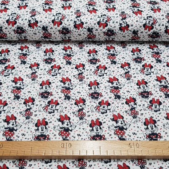 Cotton Disney Minnie Classic Hearts fabric - Disney licensed cotton fabric with classic drawings of the character Minnie where the color red predominates, and a background with tiny hearts. The fabric is 140cm wide and its composition is 100% cotton.