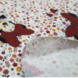 Cotton Disney Minnie Flowers White fabric - Disney licensed children's cotton fabric with drawings of the Minnie character on a flowered background where white is predominant. The fabric is 140cm wide and its composition is 100% cotton.