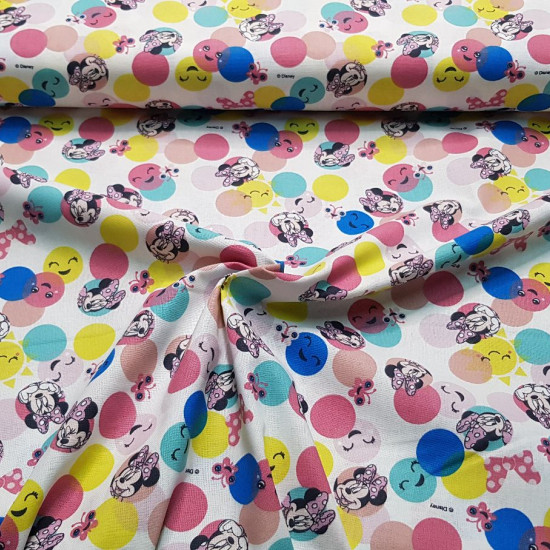 Cotton Disney Minnie Polka Dots Colors fabric - Children's cotton poplin fabric with Disney licensed drawings where the Minnie character appears in colored circles with ornaments and smiling faces. The fabric is 140cm wide and its composition is 100% cott