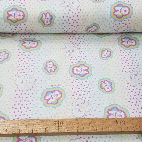 Cotton Disney Minnie Multicolor Dots fabric - Disney licensed cotton fabric with drawings of the Minnie mouse colored on a white background with multicolored rainbow effect dots. The fabric is 150cm wide and its composition is 100% cotton.