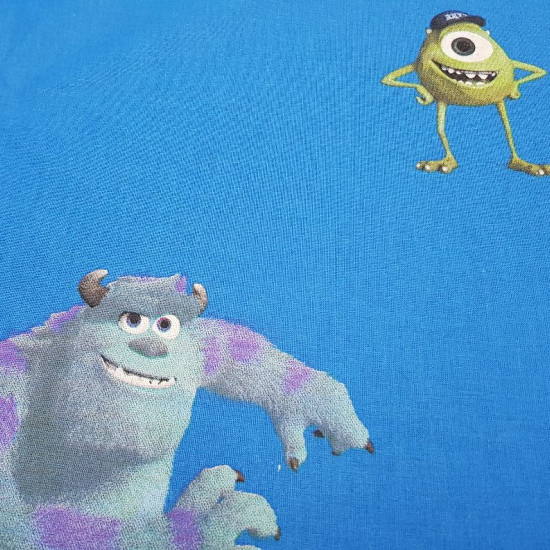 Cotton Disney Monsters University fabric - Decorative Disney licensed cotton fabric with large drawings of the characters from the movie Monsters University, on a blue background. The characters Sulley, Mike, appear among other monsters. The fabric is 140