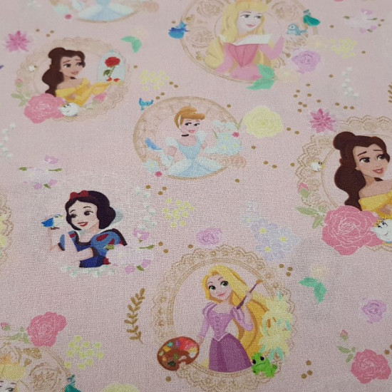 Cotton Disney Princesses Love Pink fabric - Disney licensed cotton fabric with the characters of Disney princesses SnowWhite, Cinderella, Rapuntzel, Aurora, Bella and Ariel on a pink background. The fabric is 150cm wide and its composition is 100% cotton.