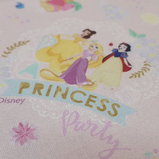 Cotton Disney Princesses Magical Memories fabric - Disney licensed cotton fabric with drawings of princesses from various films such as Ariel, Bella, Cinderella, Aurora, Snow White, Rapuntzel... on a pink background. The fabric measures between 140-150cm 