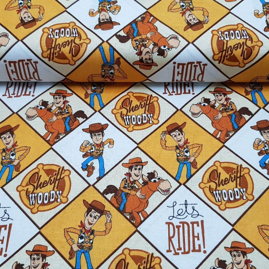 Cotton Toy Story Woody fabric - Disney licensed cotton fabric with the character Woody, the cowboy from the movie Toy Story, who appears in several panels on his Bullseye horse. The fabric is 110cm wide and its composition is 100% cotton.