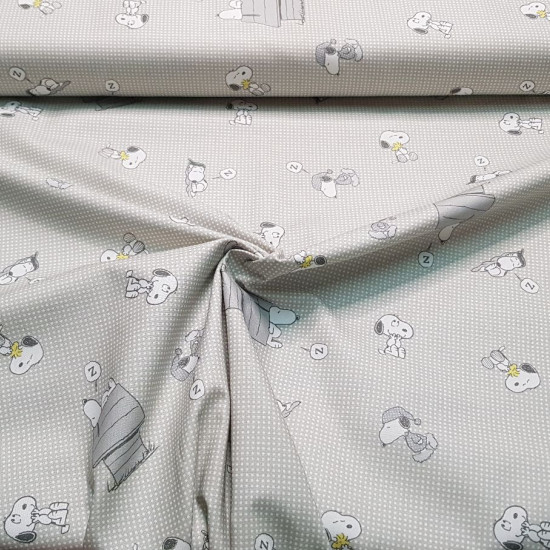 Cotton Snoopy Sleeping fabric - Licensed cotton poplin fabric with drawings of the classic character Snoopy, where he appears with Woodstock the little bird and also sleeping at home. A gray grid-like background predominates. The fabric is 140cm wi