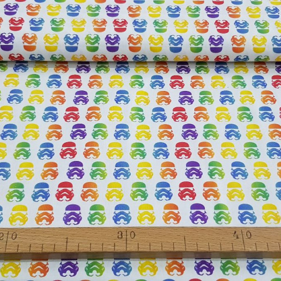 Cotton Star Wars Rainbow Imperial Helmets fabric - Cotton fabric with drawings of helmets of the imperial soldiers from the famous Star Wars saga in a multicolored “rainbow” style on a white background. The fabric is 150cm wide and its composition 100% co