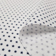 Cotton Tiny Stars Poppy fabric - Poplin cotton fabric with drawings of tiny stars on various backgrounds to choose from. The fabric is 150cm wide and its composition is 100% cotton.