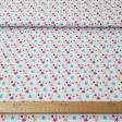 Cotton Stars Colors fabric - Cotton fabric with drawings of colored stars and various sizes on a white background. The fabric is 150cm wide and its composition is 100% cotton.